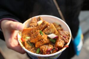 Bowl of marinated tofu cubes tossed with miso and sesame seeds